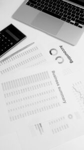 accounting and business services worksheets and laptop