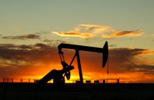 Working oil well at sunset